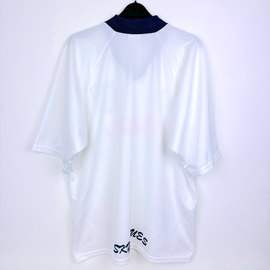 Rear view of white Coventry City retro football shirt produced by le coq sportif. Navy 'Sky Blues' print to bottom of shirt.