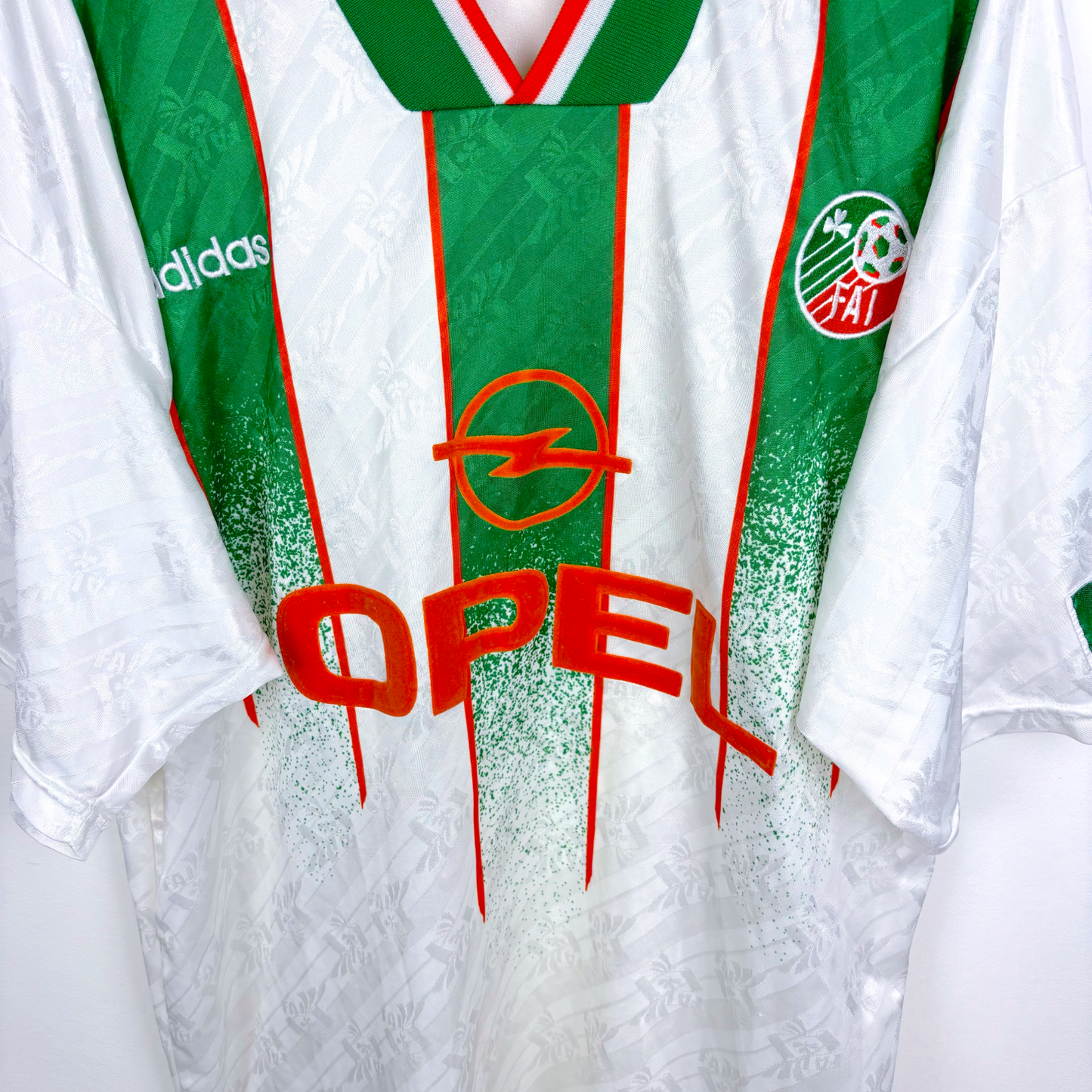 Vintage football shirt with green vertical stripes, white base, Adidas logo, and Opel sponsor in red. - Eire Ireland 1994-1995 USA World Cup Away Football Shirt Adidas