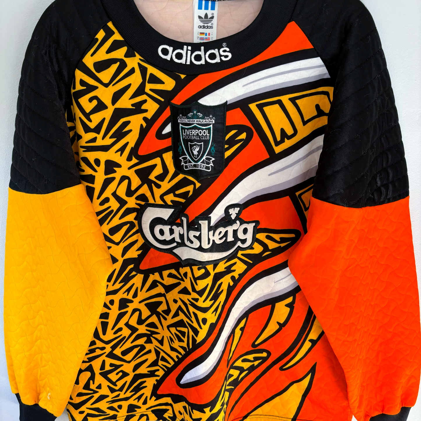 Liverpool FC 1995-1996 vintage football shirt with bold black, orange, and yellow retro soccer jersey design and Carlsberg. - Liverpool FC 1995-1996 Goal Keeper Football Shirt Adidas