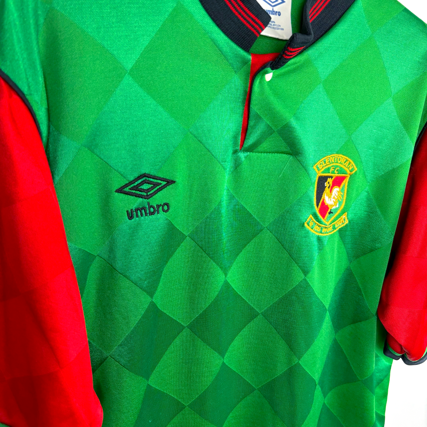 Side view of Glentoran retro football shirt produced by Umbro. Embroidered Umbro logo and club crest