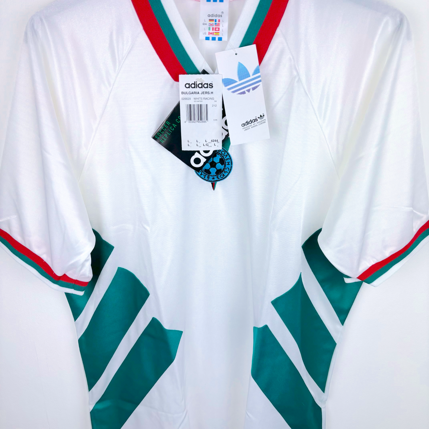 Side angled view of retro Bulgaria 1994 home football shirt by adidas with green and red trim