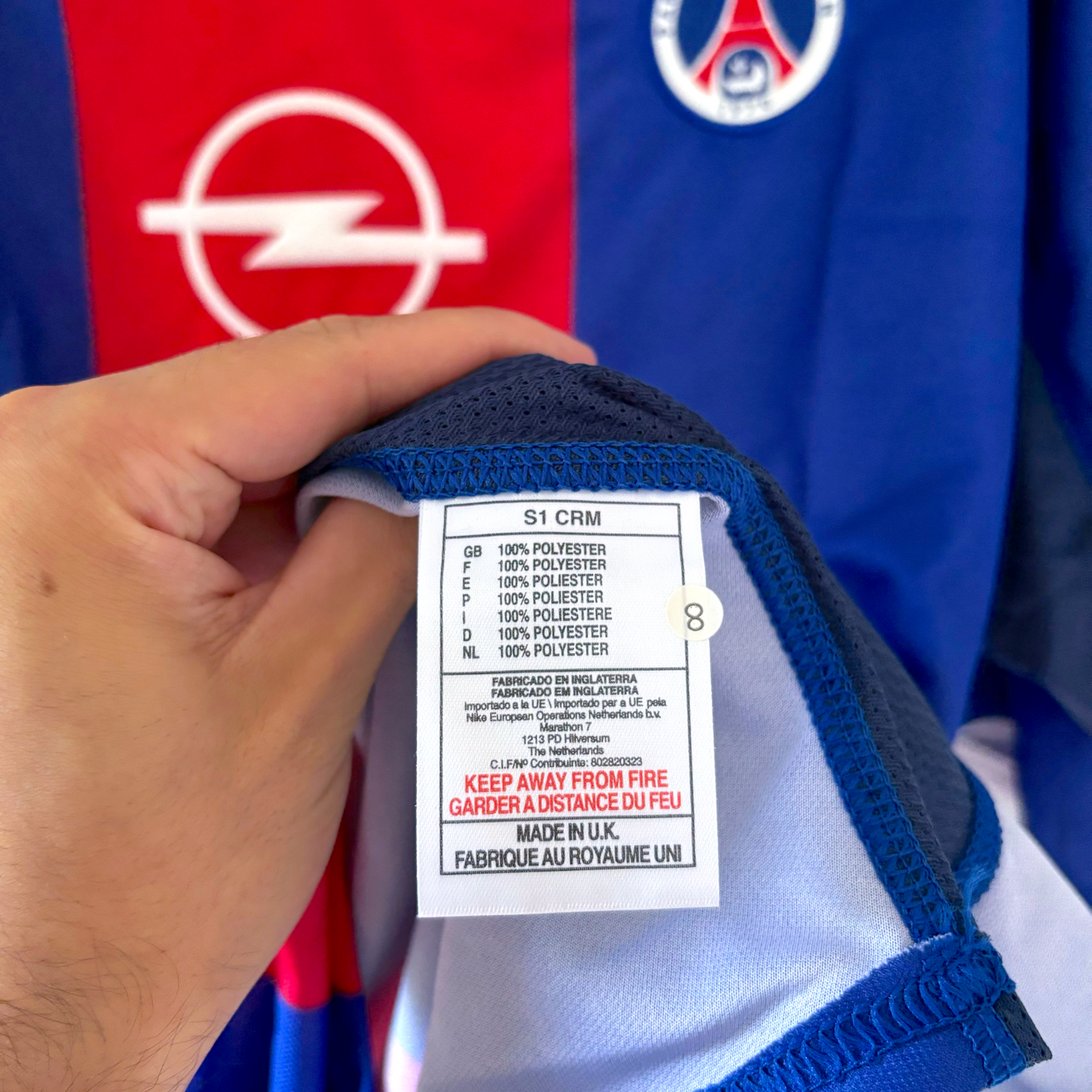 Tag inside vintage football shirt showing fabric content and care instructions for retro football shirts. - BWNT Paris Saint Germain PSG 1999-2000 Home Football Shirt Maillot Nike