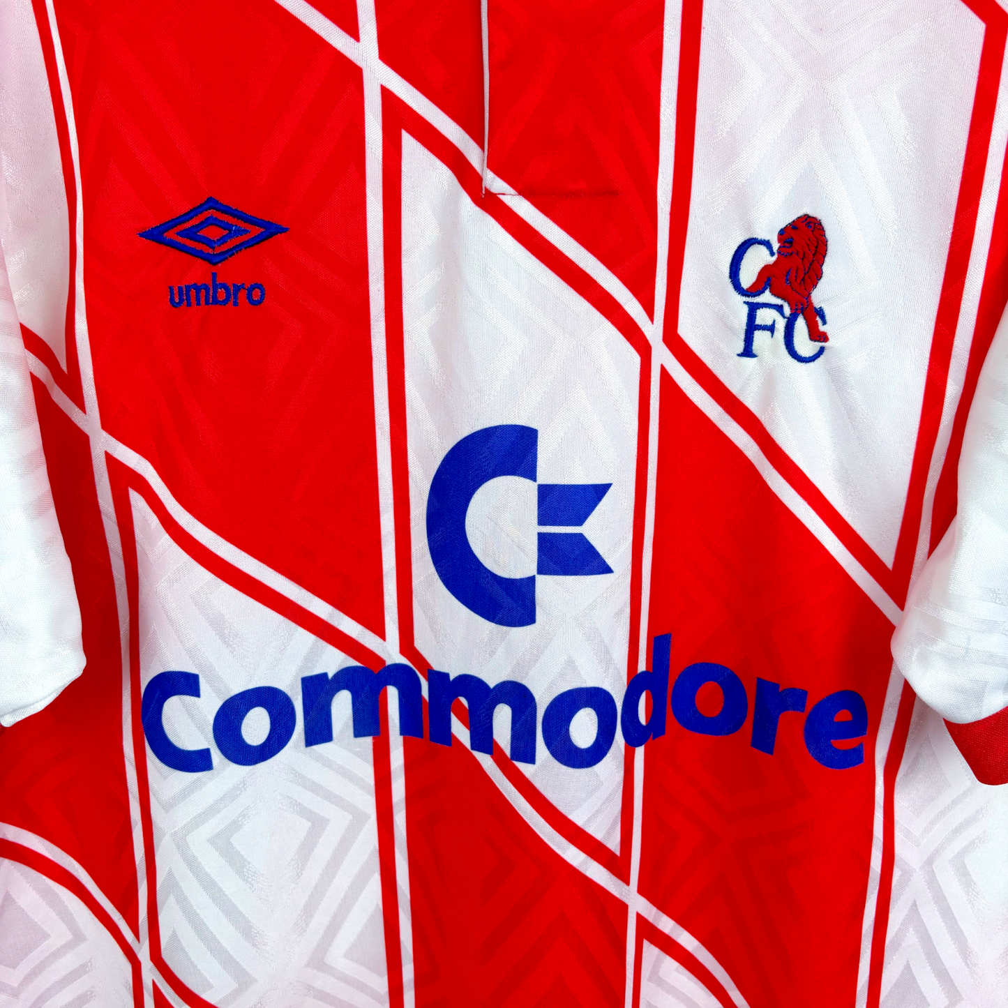 Chelsea 1990/1991/1992 away vintage football shirt with red and white geometric pattern, Umbro logo, and Commodore sponsor. - Chelsea 1990/1991/1992 Away Football Shirt Umbro