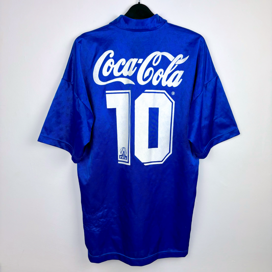 Back view of blue vintage Cruzeiro football shirt with white "Coca-Cola" sponsor and number 10 on back, short sleeves.