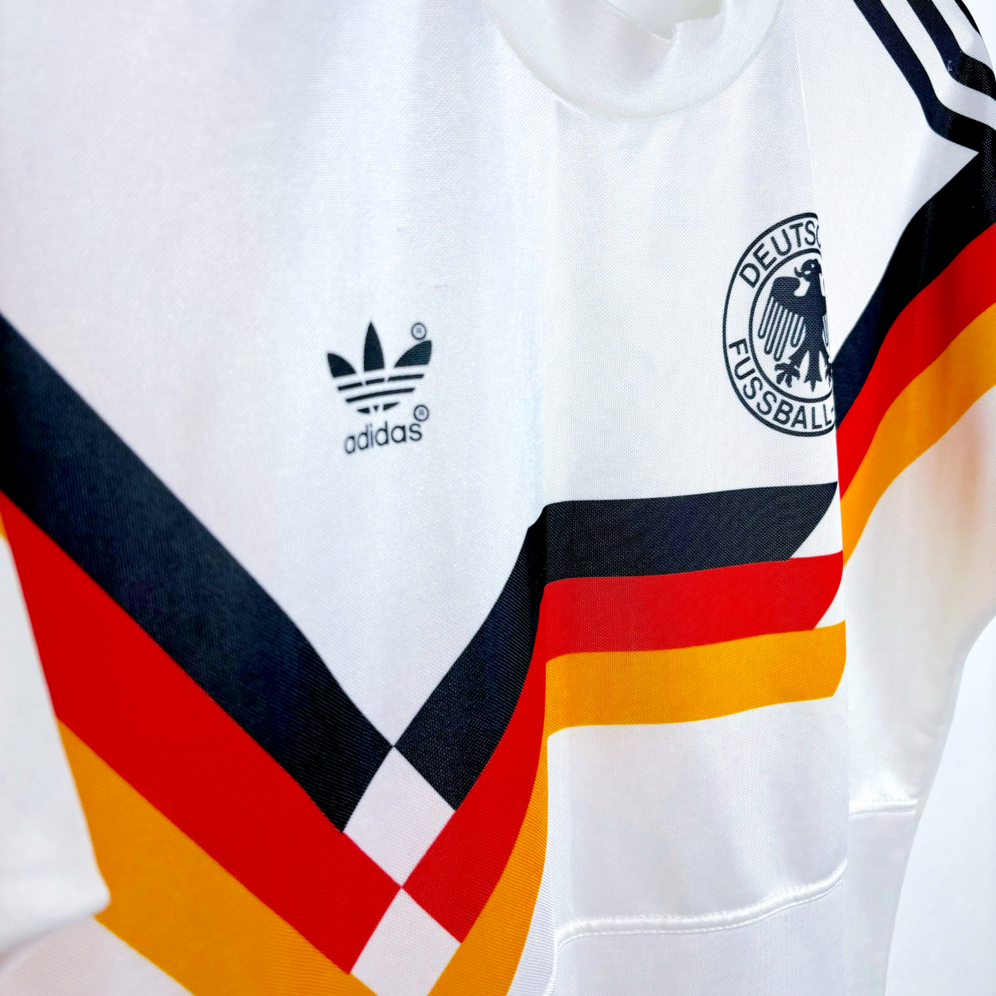 White Germany vintage football shirt with black Adidas trefoil logo and black, red, yellow retro soccer jersey stripes. - Germany 1988/1989/1990/1991/1992 Adidas Home Football Shirt