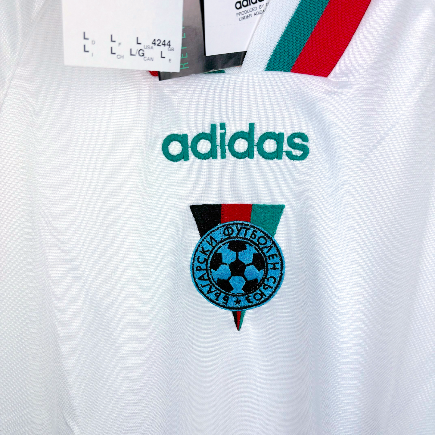 Close up of a Bulgaria 1994 classic football jersey by adidas with green and red trim