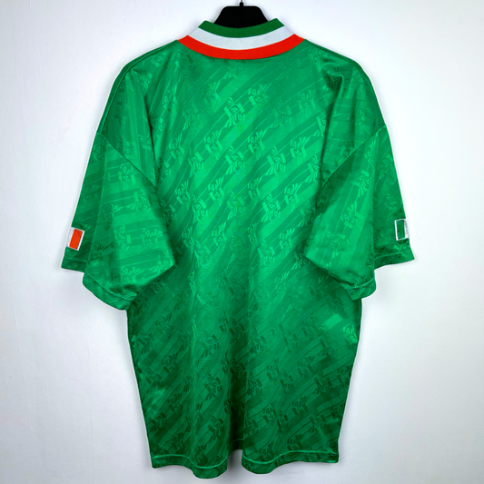 Green vintage football shirt with subtle geometric pattern, tricolor collar, and Ireland flag patches on sleeves. - Eire Ireland 1994-1995 USA World Cup Home Football Shirt Adidas