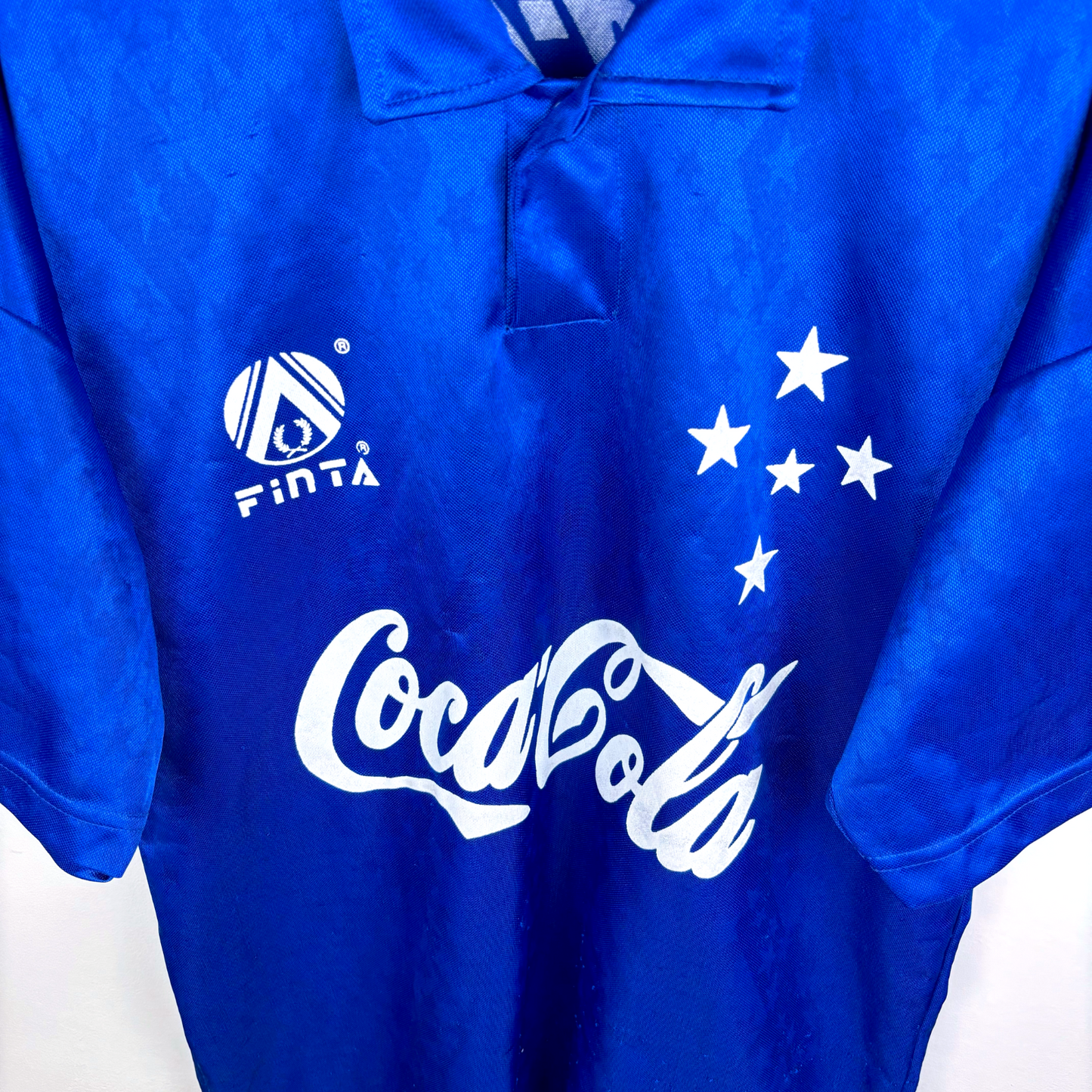 Vintage Cruzeiro football shirt in royal blue with white Coca-Cola sponsor logo, Finta brand emblem, and five white stars on - Cruzeiro 1993/1994/1995 Home Football Shirt Camisa Finta