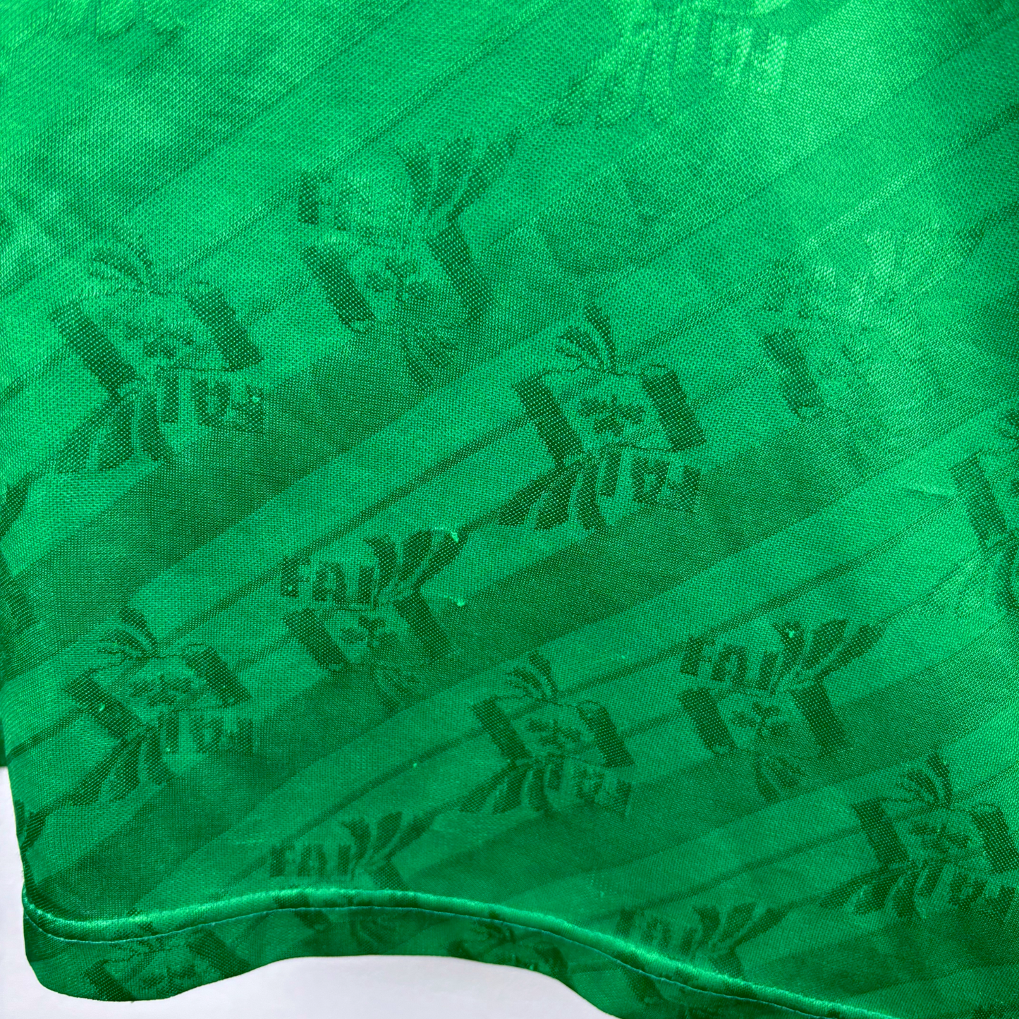 Green vintage football shirt with dark abstract pattern and textured fabric, retro football shirt style. - Eire Ireland 1994-1995 USA World Cup Home Football Shirt Adidas