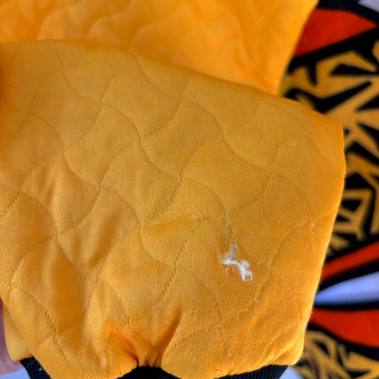 Yellow quilted sleeve detail of vintage retro football shirt with visible wear and sewn stitching. - Liverpool FC 1995-1996 Goal Keeper Football Shirt Adidas