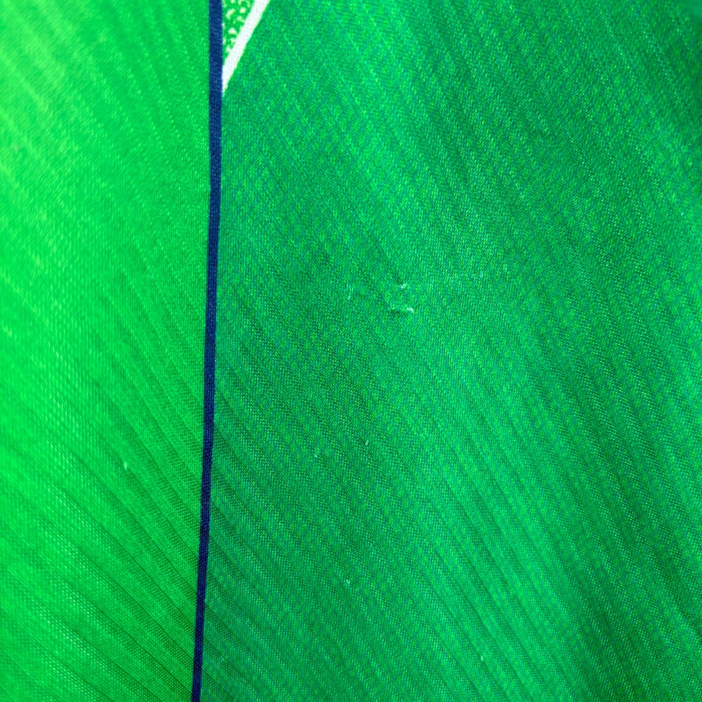 Green vintage football shirt with dark blue trim and textured diagonal pattern, classic retro soccer jersey style. - Eire Ireland 1994/1995/1996 Home Football Shirt Umbro