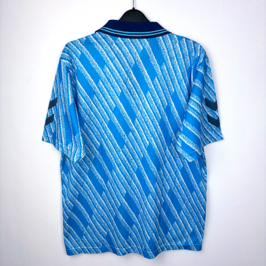 Rear view of 1992 away Brentford old football shirt made by Hummel. Geometrical sky-blue pattern and navy collar. KLM airlines sponsor.