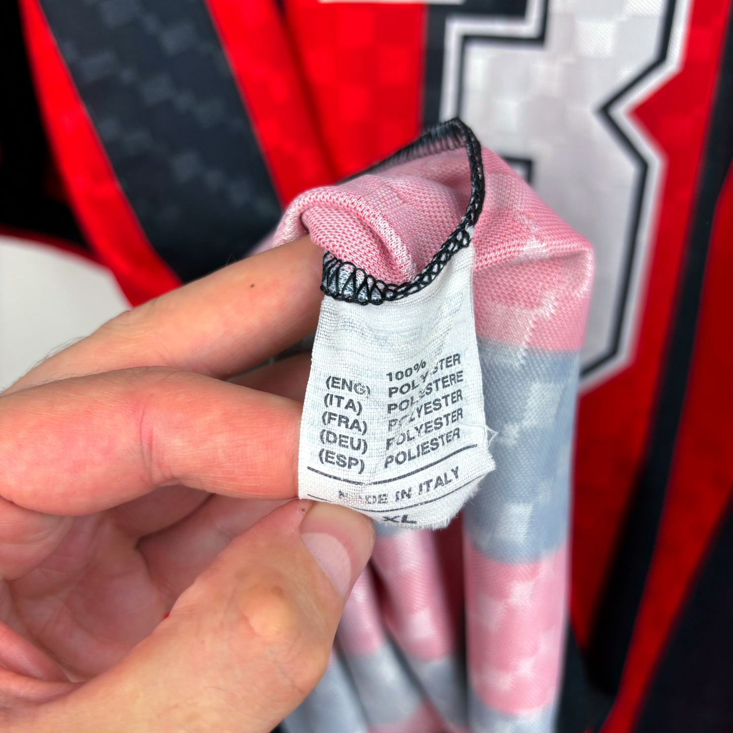 AC Milan 1994/1996 vintage football shirt fabric tag showing polyester material and Made in Italy label on retro football. - AC Milan 1994/1995/1996 Home Football Shirt Maglia Lotto - Maldini 3