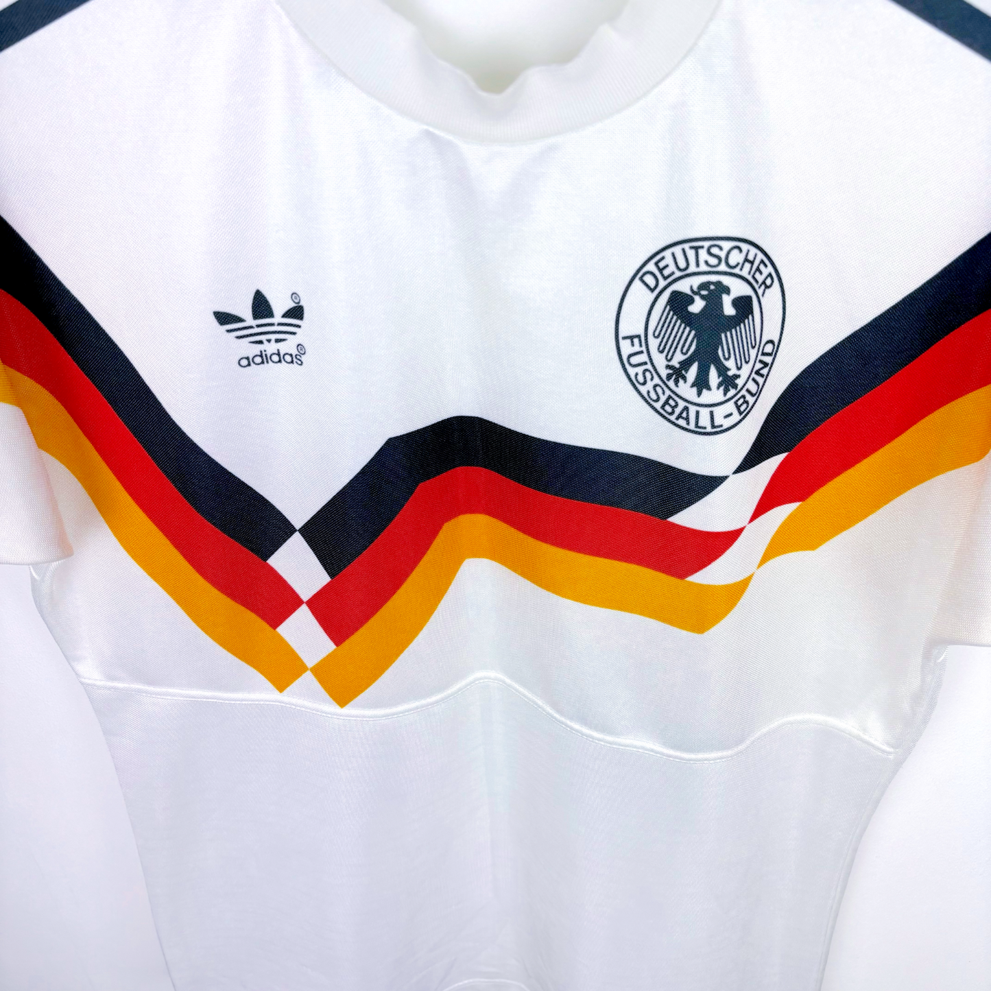 White vintage football shirt with Germany badge, Adidas logo, and retro tricolor chevron stripes. - Germany 1988/1989/1990/1991/1992 Adidas Home Football Shirt