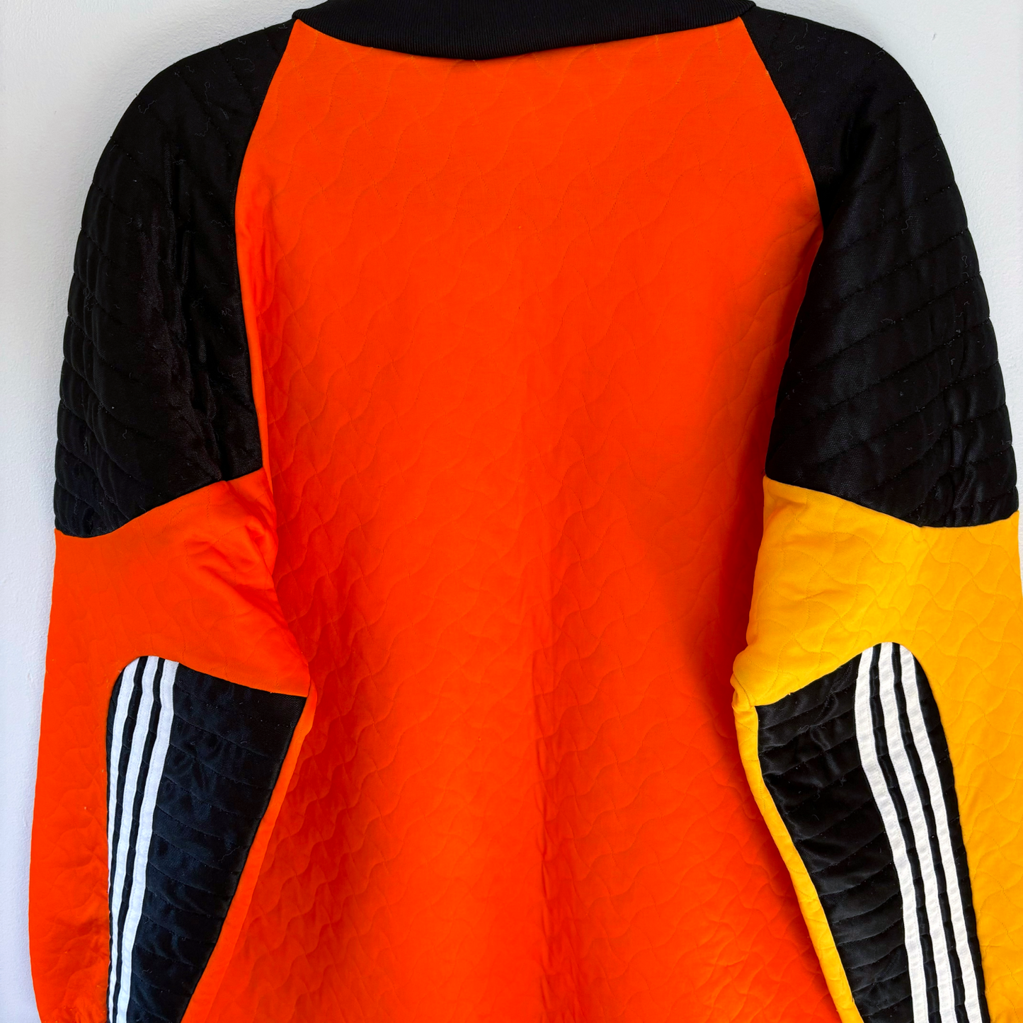 Vintage Liverpool FC 1995-1996 goalkeeper football shirt in bright orange with black and yellow quilted sleeves, retro. - Liverpool FC 1995-1996 Goal Keeper Football Shirt Adidas