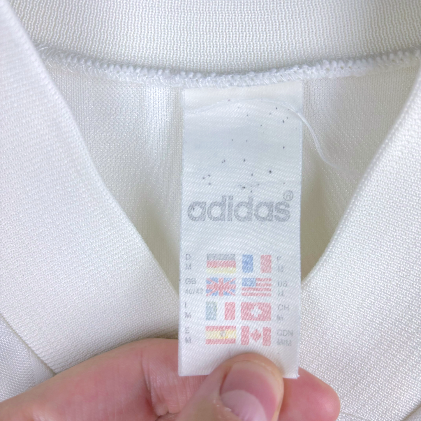 White Adidas tag on vintage football shirt collar with washing symbols and international flags. - Équipe de France FFF 1992/1993/1994 Away Football Maillot Shirt Adidas