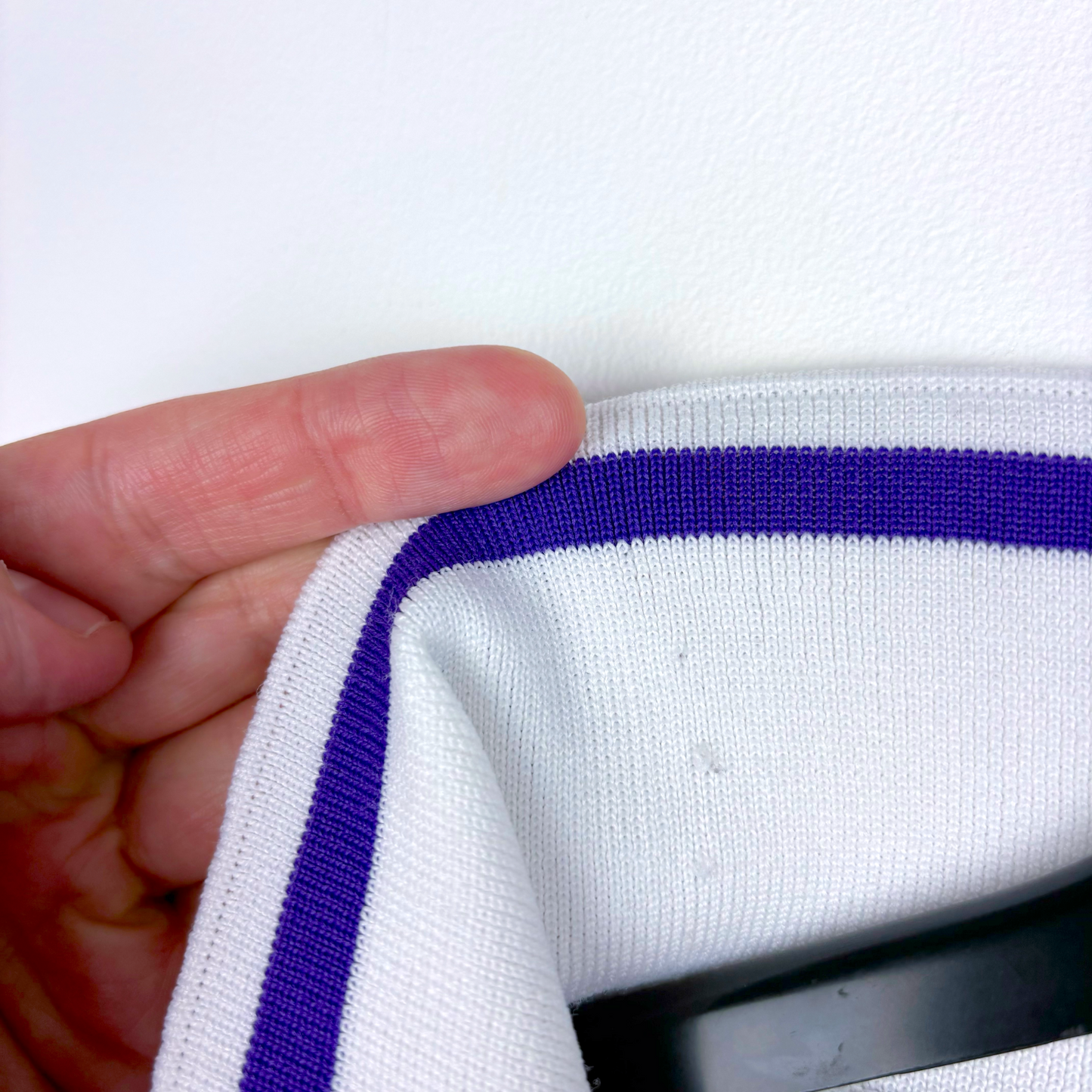 Close-up of white vintage football shirt sleeve with purple trim, showcasing classic knit fabric of retro football shirts. - Clydebank FC Wet Wet Wet 1993/1994/1995 Away Football Shirt Matchwinner
