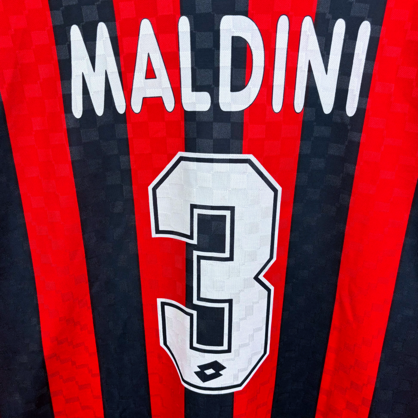 Red and black striped vintage football shirt with Maldini name and number 3 in white, retro soccer jerseys style. - AC Milan 1994/1995/1996 Home Football Shirt Maglia Lotto - Maldini 3