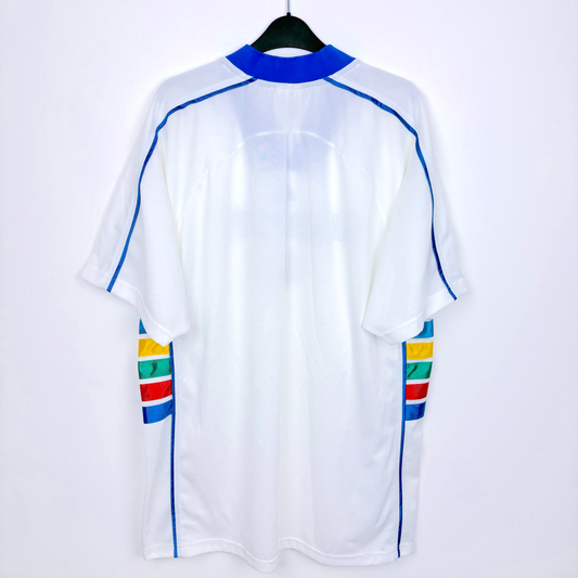 Rear view of white Kansas City 1997-1998 vintage soccer jersey produced by Adidas. White body featuring rainbow coloured side panels.