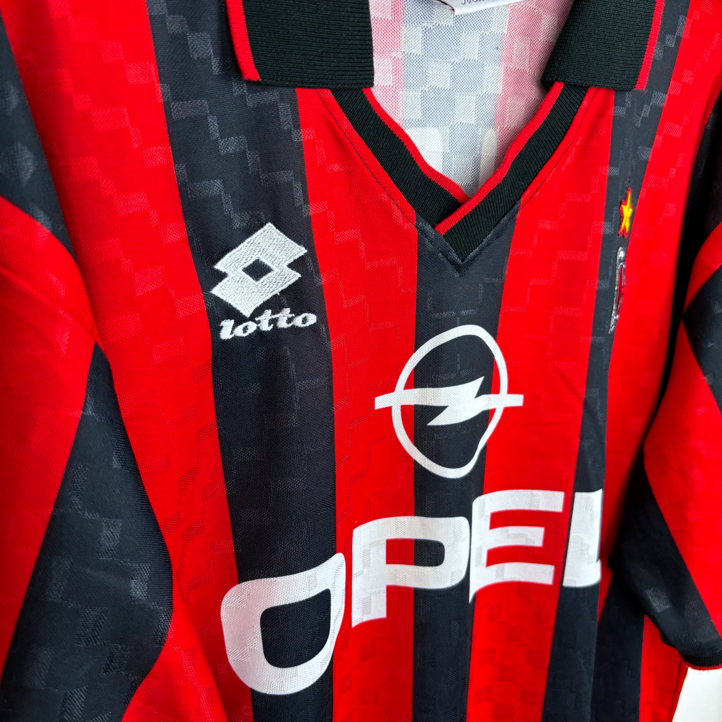 Vintage AC Milan home football shirt with red and black stripes, Lotto logo, and Opel sponsor. - AC Milan 1994/1995/1996 Home Football Shirt Maglia Lotto - Maldini 3