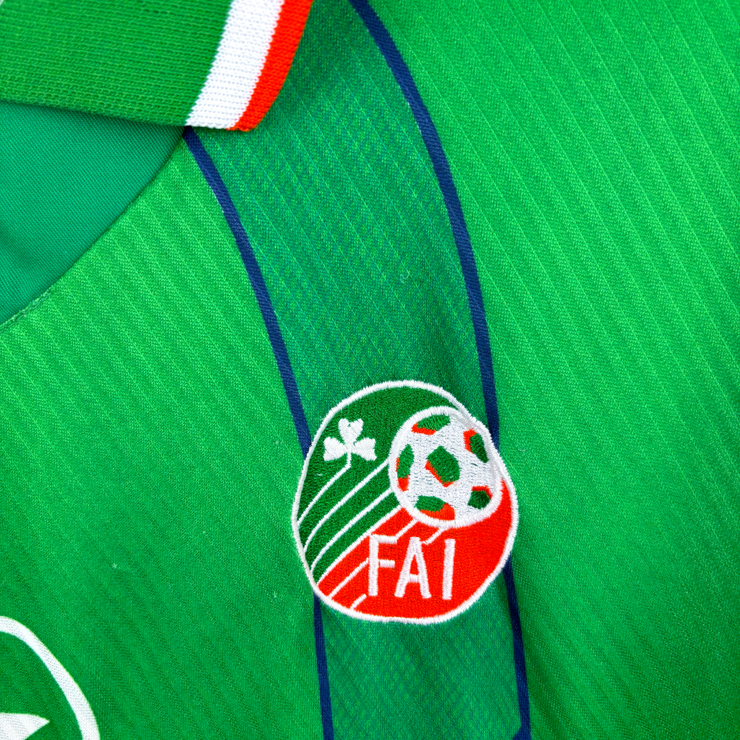 Green vintage football shirt with FAI crest and blue stripes, retro soccer jersey detail. - Eire Ireland 1994/1995/1996 Home Football Shirt Umbro