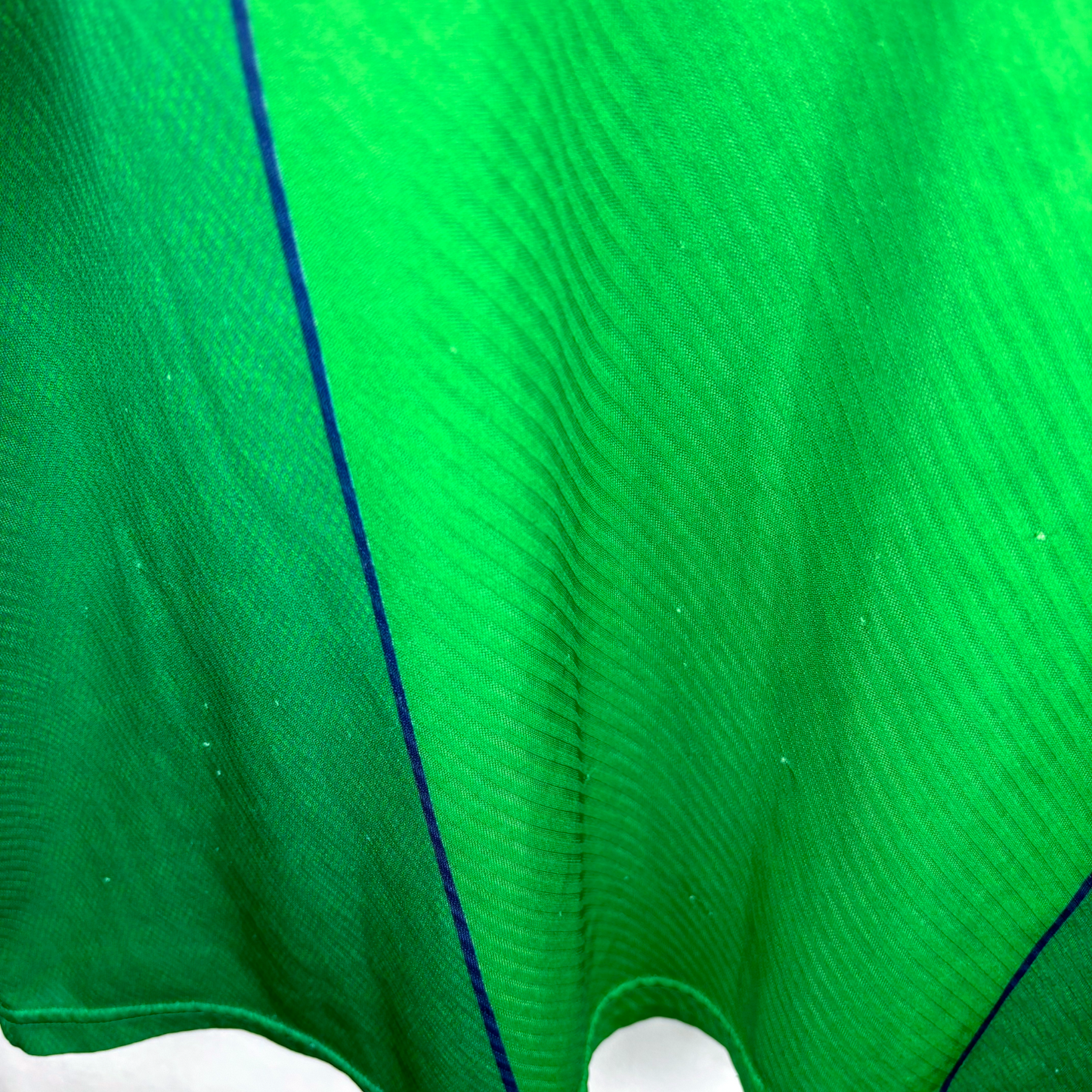 Green vintage football shirt with subtle vertical stripes and thin blue piping detail, classic retro soccer jersey style. - Eire Ireland 1994/1995/1996 Home Football Shirt Umbro