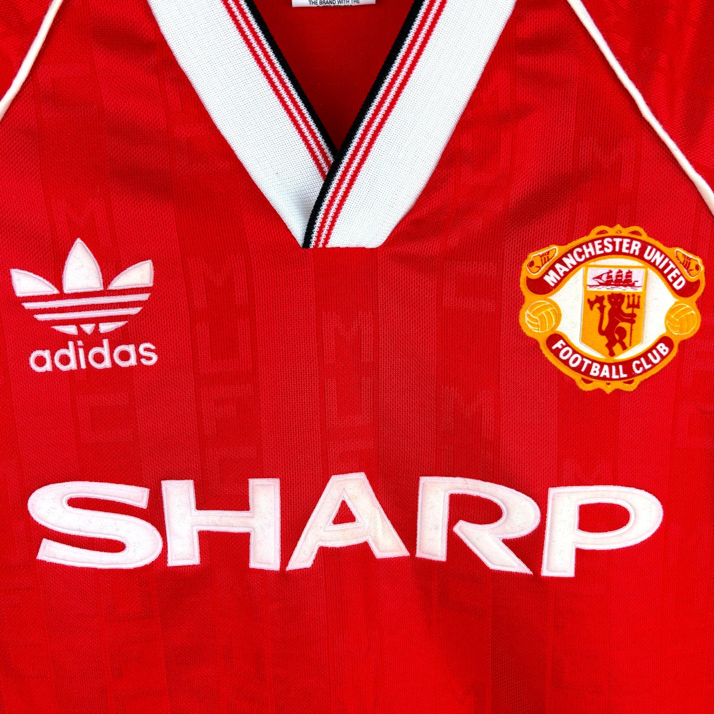 Close-up of club crest and Adidas logo on Manchester United 1988-1990 Home Shirt – vintage football shirt