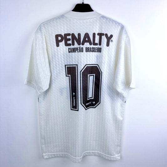 Rear view of Atletico Mineiro 1992-1993 Penalty retro soccer jersey white body and black pattern.