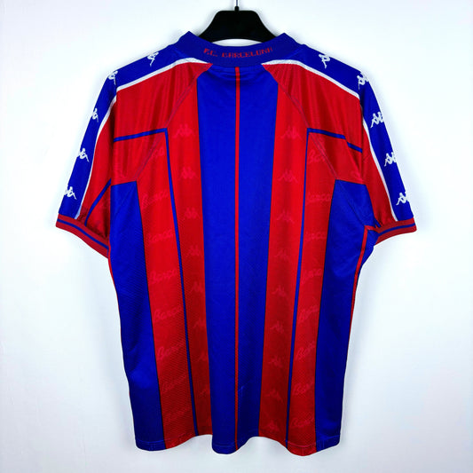 Rear view of FC Barcelona 1997-1998 home classic soccer jersey made by Kappa. Red and blue stripes with embroidered badge.