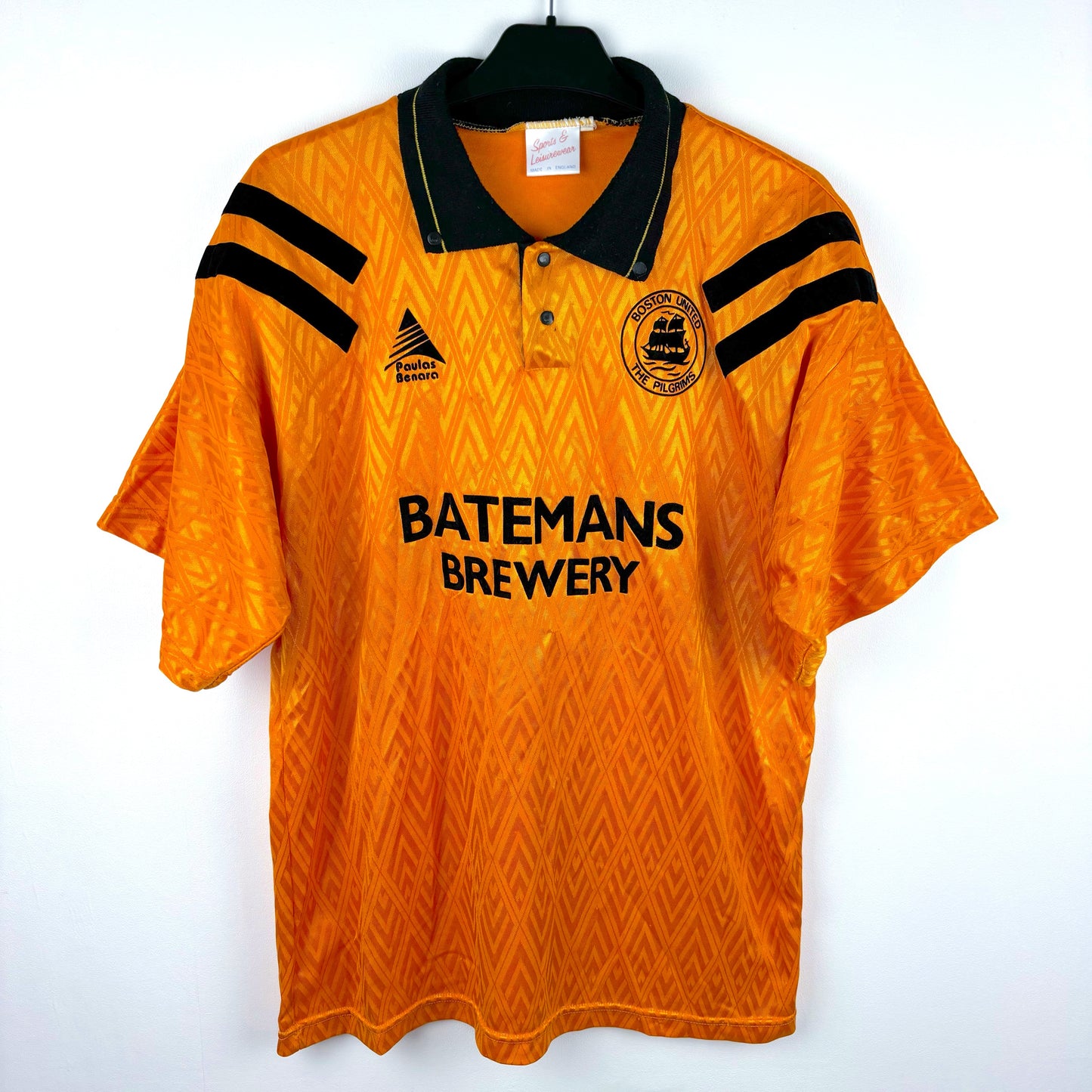 Front view of Boston United 1991-1993 Paulas Benara Home Football Shirt in orange with black trim. Classic Batemans Brewery sponsor in the middle.