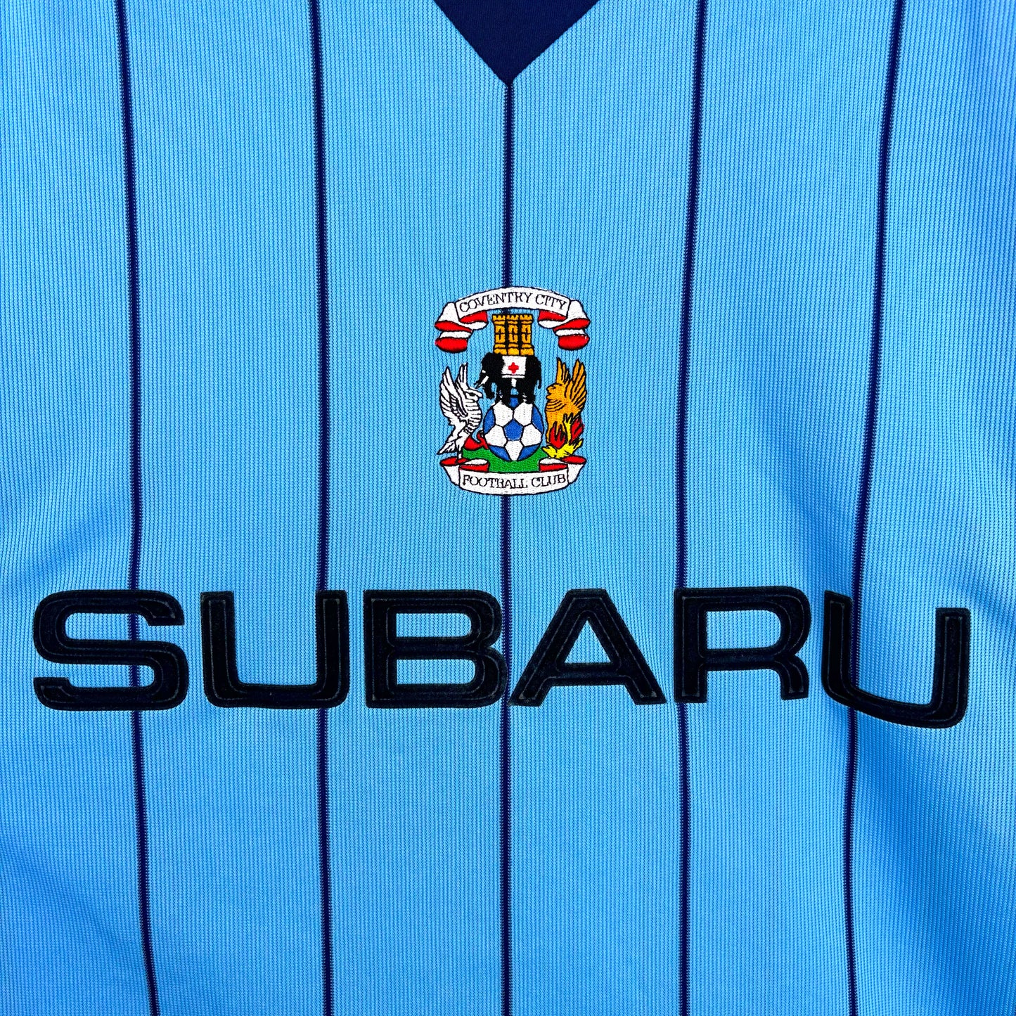 Close-up of Coventry City 2003 home shirt – detailed view showing Coventry crest and Subaru sponsor logo