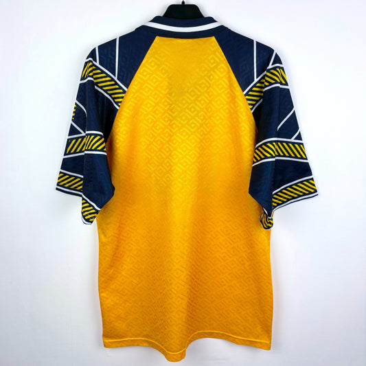 Rear view of Falkirk 1994-1995 Matchwinner away classic football shirt. Yellow body with navy sleeves. Beazer Homes sponsor.