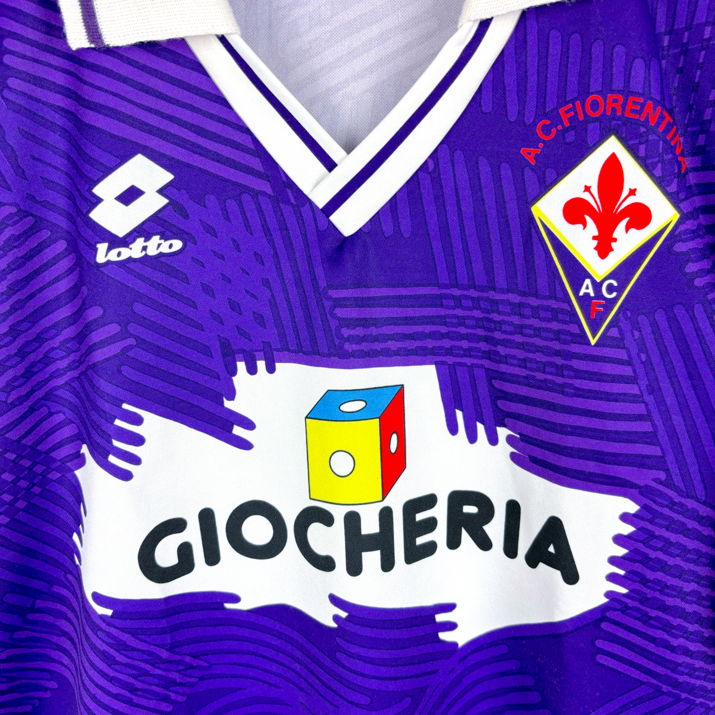 Close up of Fiorentina 1991-1992 home classic football shirt produced by Lotto. Features club crest and retro Giocheria sponsor