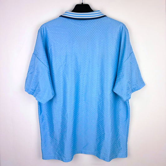 Rear view of Man City 1995-1997 Umbro home classic football shirt. Sky blue body with sublimated checkered pattern.