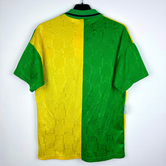 Rear view of Manchester United 1992-1994 Umbro vintage football jersey. Green and gold two tone body with SHARP sponsor.