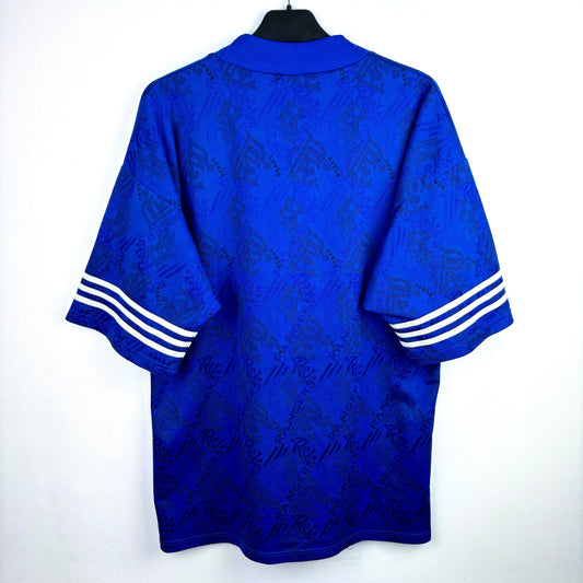Rear view of Rangers 1994-1996 adidas home retro football shirt. Blue body with classic three stripes around sleeves.