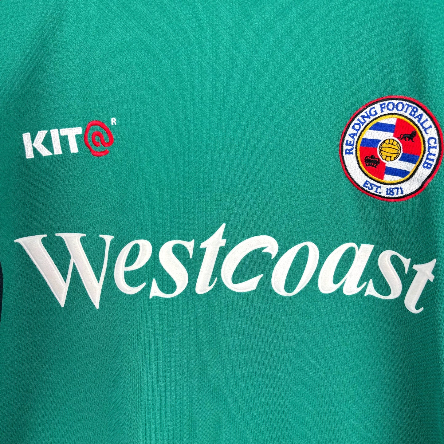 Close up central view of retro Reading FC 2001-2003 Goalkeeper Football Shirt. Embroidered Reading FC badge, Kit manufacturer and Westcoast sponsor