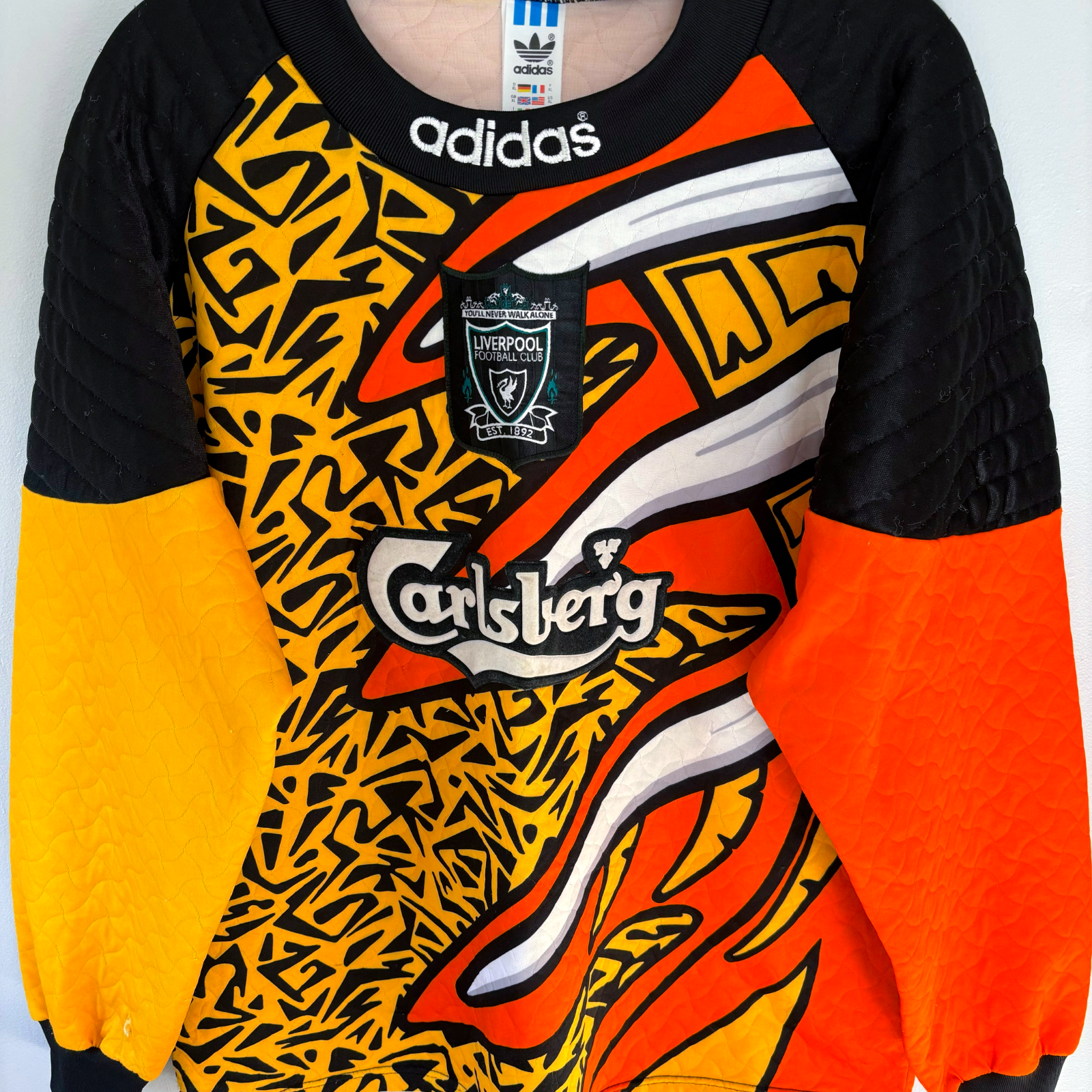 Liverpool FC 1995-1996 vintage football shirt with bold black, orange, and yellow retro soccer jersey design and Carlsberg. - Liverpool FC 1995-1996 Goal Keeper Football Shirt Adidas