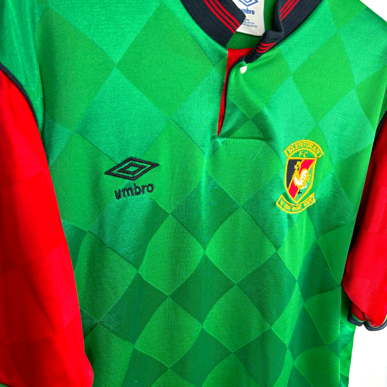 Side view of Glentoran retro football shirt produced by Umbro. Embroidered Umbro logo and club crest