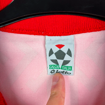 Close-up of vintage football shirt label with Lotto logo and Calcio Italia text on pink fabric. - Morocco 1994/1995/1996 Home Football Shirt Maglia Calcio Lotto