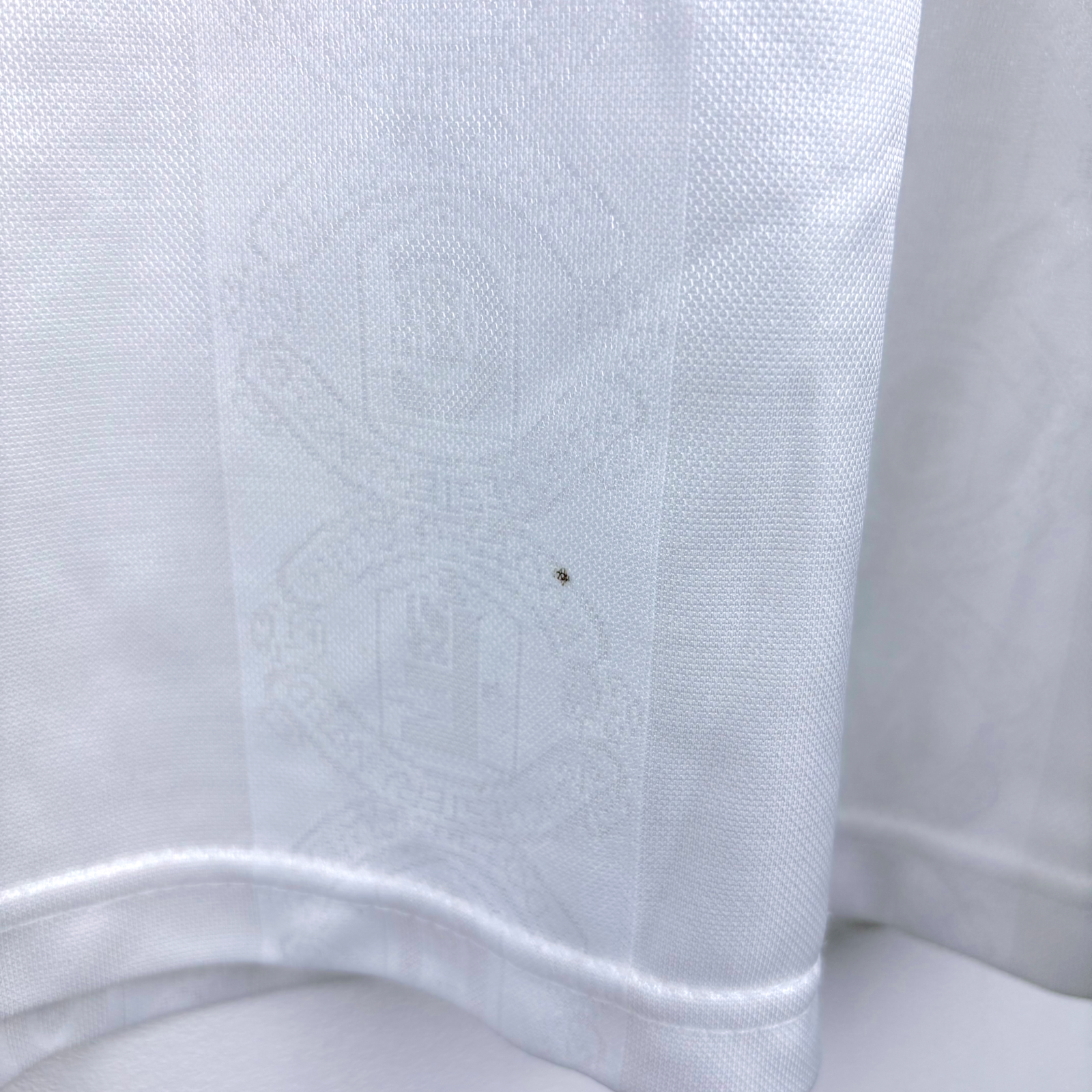 White vintage retro football shirt with subtle embossed Manchester United crest detail and long sleeves. - Manchester United 1997/1998/1999 Away Umbro Football Shirt Long Sleeve