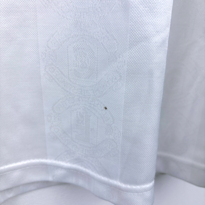 White vintage retro football shirt with subtle embossed Manchester United crest detail and long sleeves. - Manchester United 1997/1998/1999 Away Umbro Football Shirt Long Sleeve