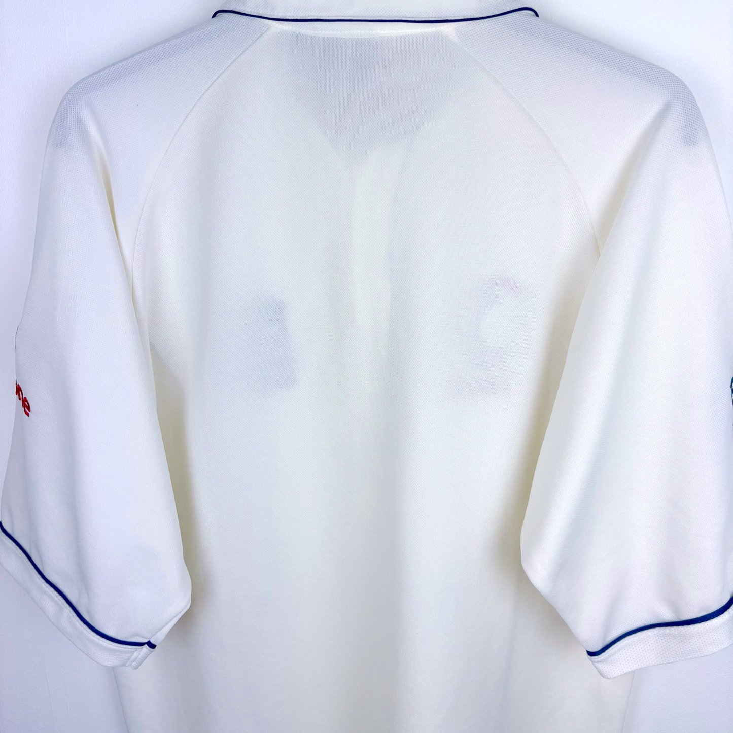 White vintage football shirt with navy piping on sleeves and collar, classic retro soccer jersey style. - England 2005/2006/2007/2008 Ashes Cricket Shirt