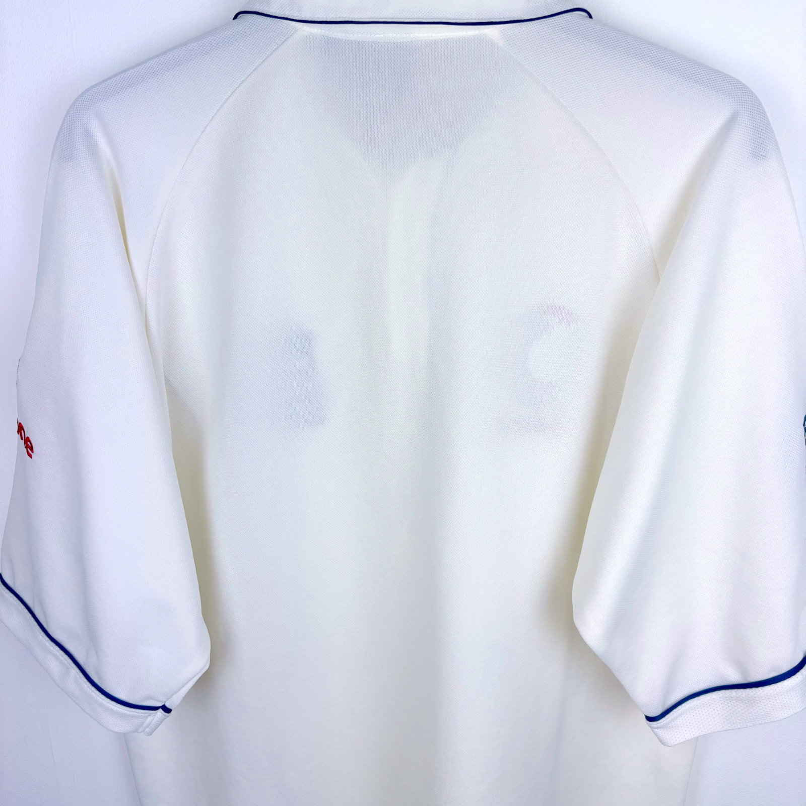 White vintage football shirt with navy piping on sleeves and collar, classic retro soccer jersey style. - England 2005/2006/2007/2008 Ashes Cricket Shirt