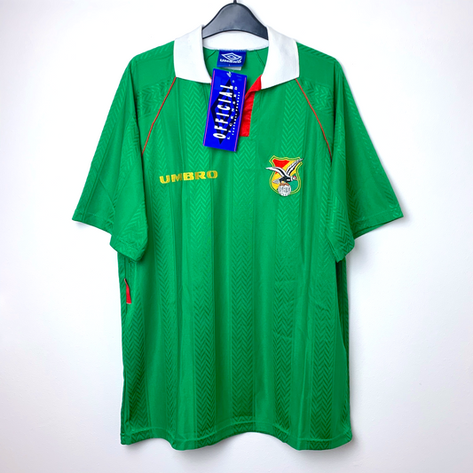 Green vintage Bolivia football shirt with Umbro logo and blue Umbro tag on a white background