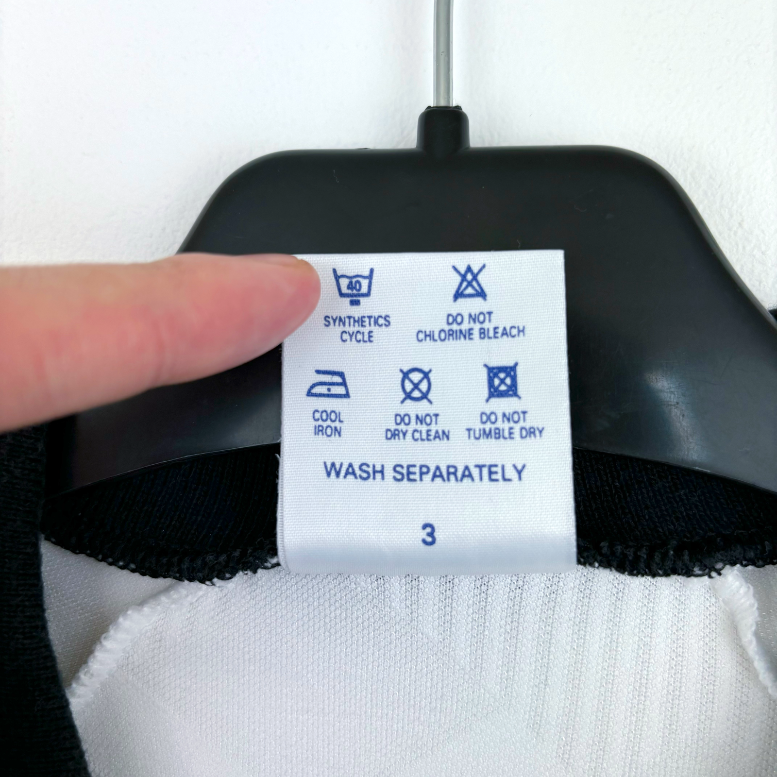 Care label on vintage retro football shirt with washing instructions and size 3 on black and white fabric. - Aston Villa 1990/1991/1992/1993 Away Football Shirt Umbro