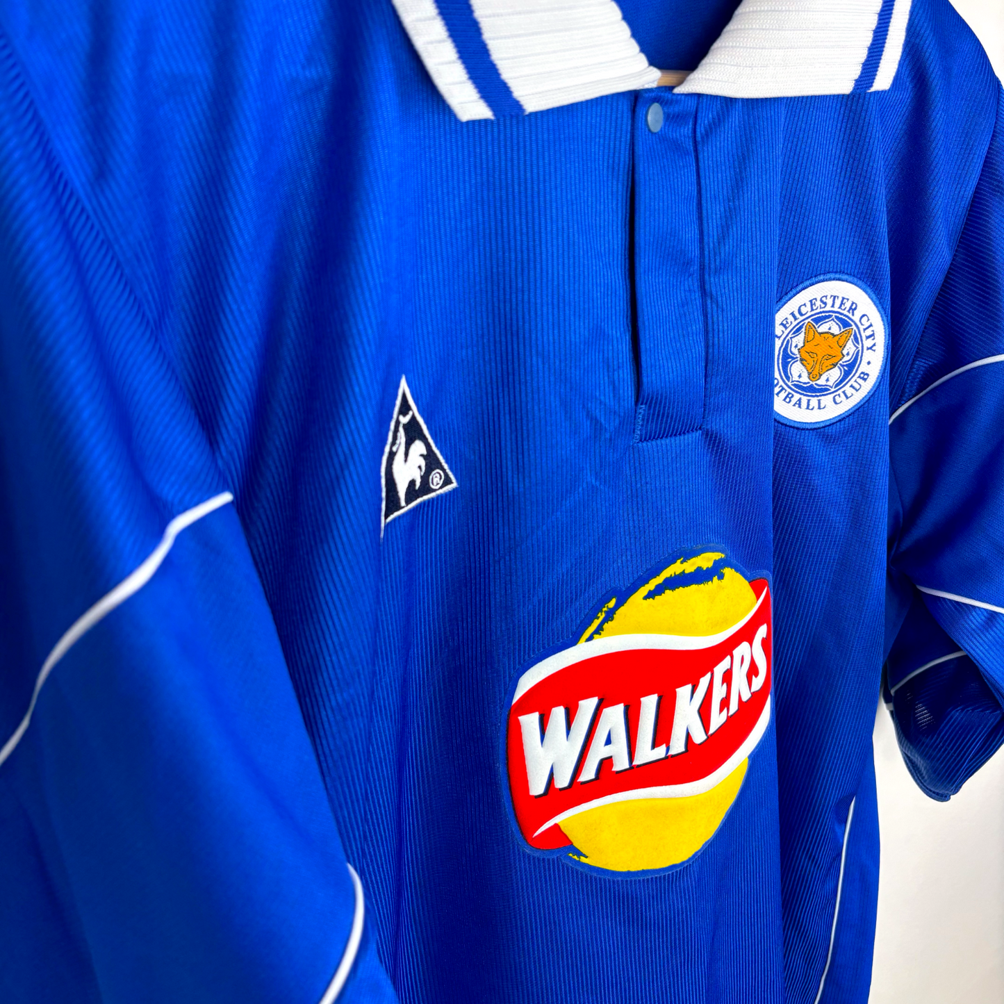 Vintage Leicester City 2000-2001 home football shirt in blue with white collar, Le Coq Sportif logo, and Walkers sponsor. - MINT Leicester City 2000-2001 Home Football Shirt Le Coq Sportif