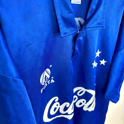 Side close up view of Cruzeiro vintage football shirt from the 1993-1995 seasons with white sponsor and logos, classic collar, short sleeves.