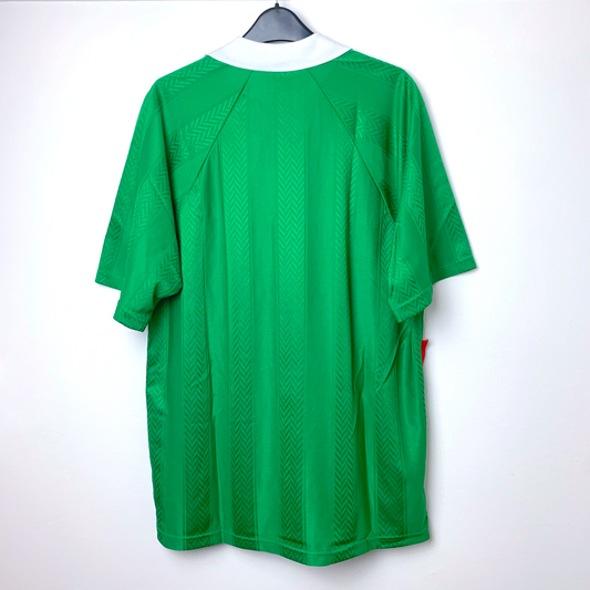 Back view of rare vintage 1994 Bolivia  Umbro jersey on a hanger against a white background