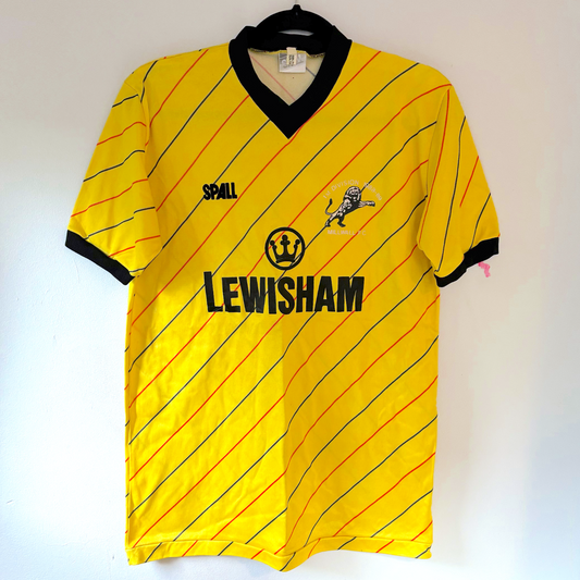 Vintage Millwall 1987-1989 away football shirt in yellow with red diagonal stripes and black trim, retro soccer jersey style. - Millwall 1987/1988/1989 Away Football Shirt Spall